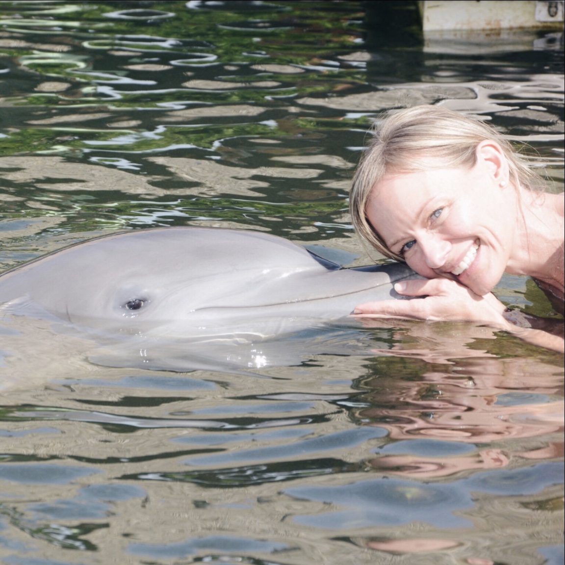 A woman with a dolphin